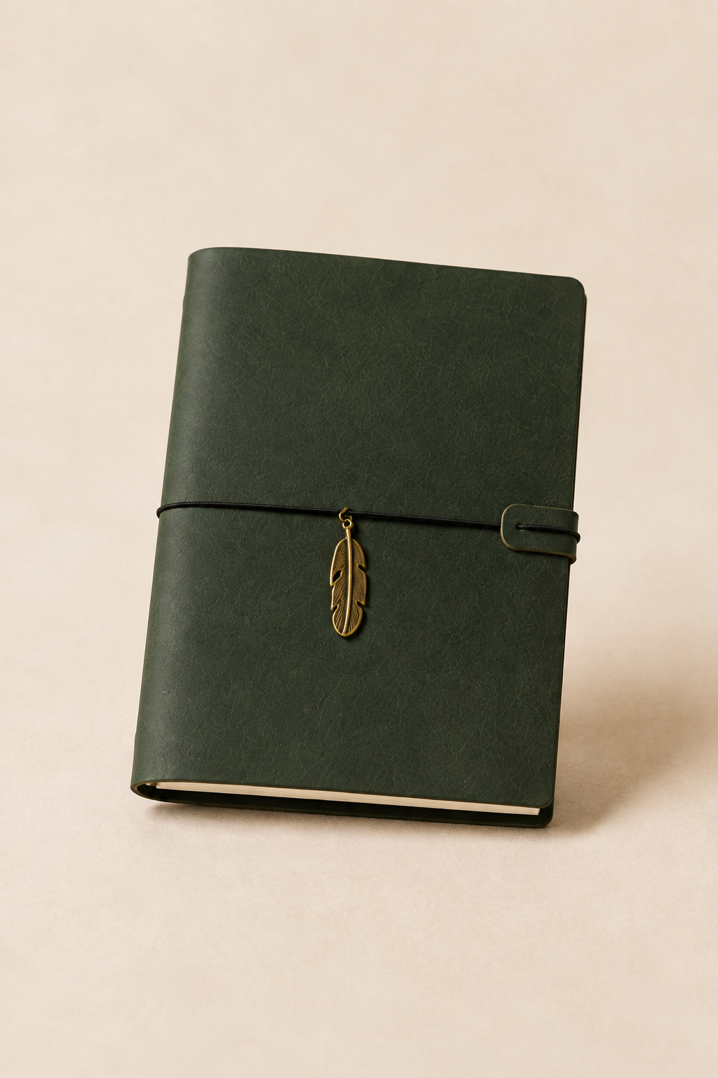 Green leather journal with brass feather charm